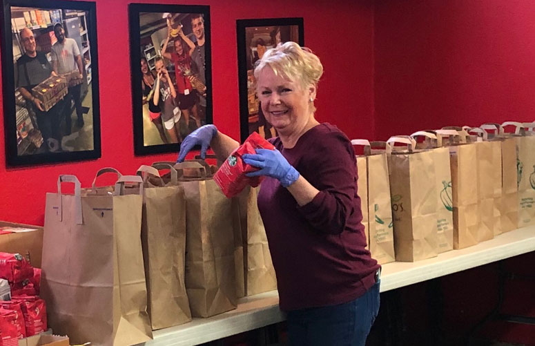 HCS Family Services stuffing bags to assist families in need.