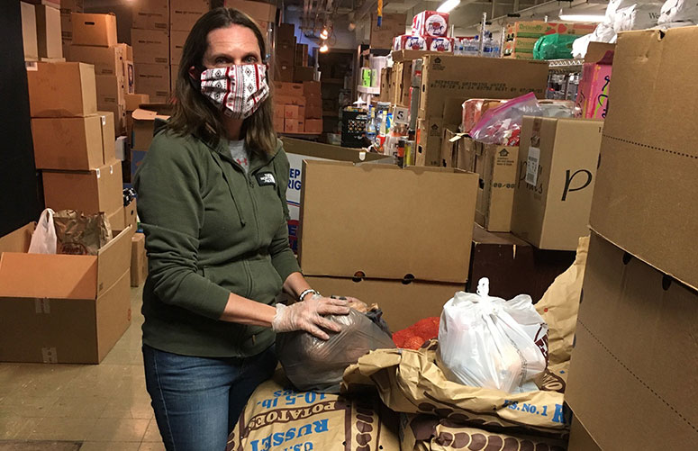 HCS Volunteer packs potatoes