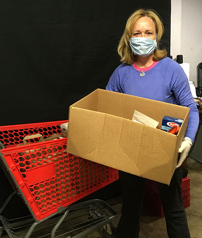 HCS Volunteer prepares food